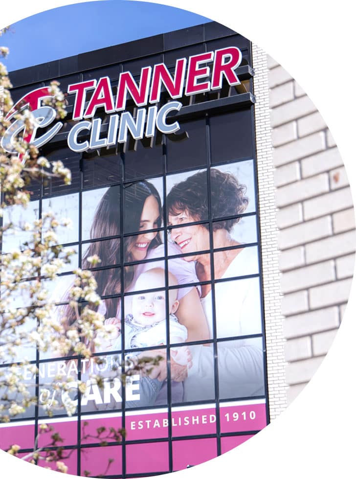 Circular image of Tanner Clinic displaying photo of a mother, her baby, and an older woman.