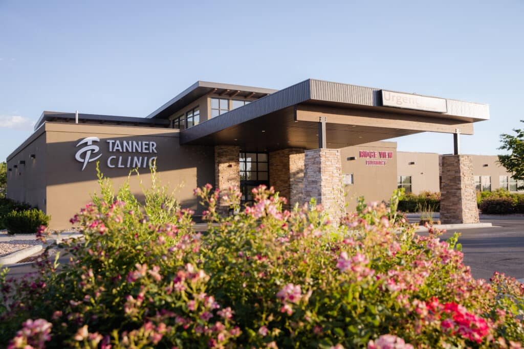 Image of Tanner Clinic with pink flowers in front.
